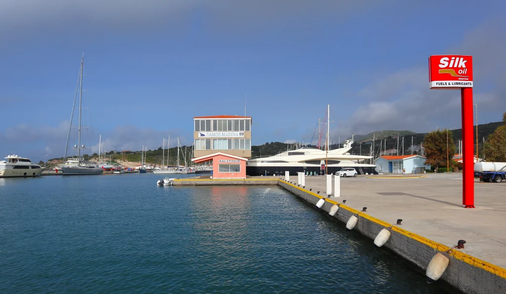 Marina Samos's office is at the entrance. The gas station is on the right.